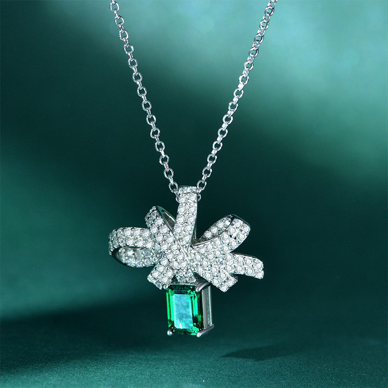 Micro Paved Bowknot with Green Emerald Cut Pendant in Sterling Silver