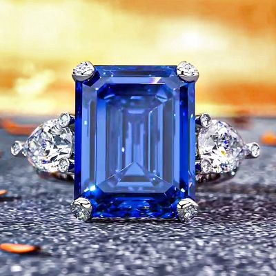 Emerald Cut & Pear Shaped Sapphire & Diamond Three-Stone Ring in Sterling Silver