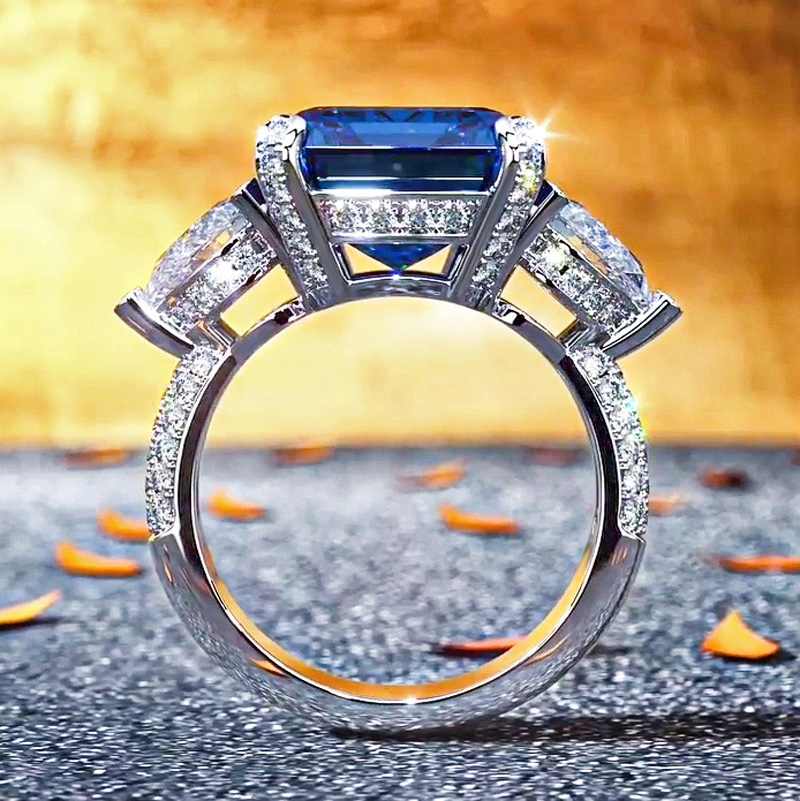 Emerald Cut & Pear Shaped Sapphire & Diamond Three-Stone Ring in Sterling Silver