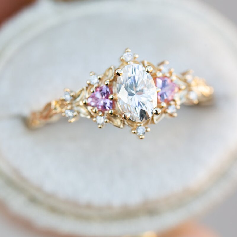 Three stones with Oval Cut Stone and Pink Sapphire Engagement Ring