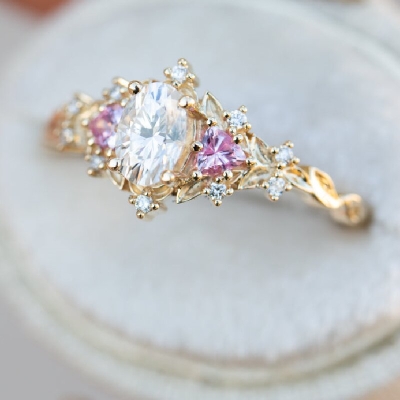 Three stones with Oval Cut Stone and Pink Sapphire Engagement Ring