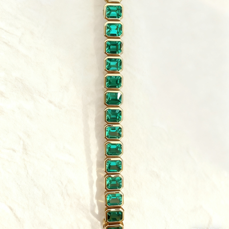 S925 Silver Emerald Tennis Bracelet in Yellow Gold