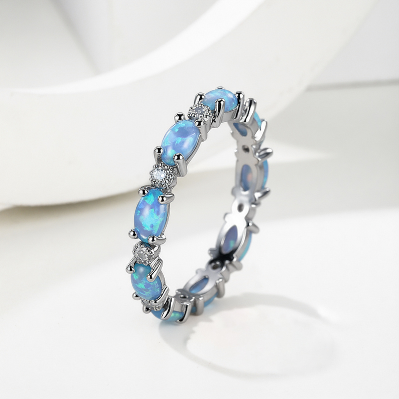 Oval Cut Blue Opal Eternity Band with White Plated Oval Cut Blue Opal Eternity Band with White Plated