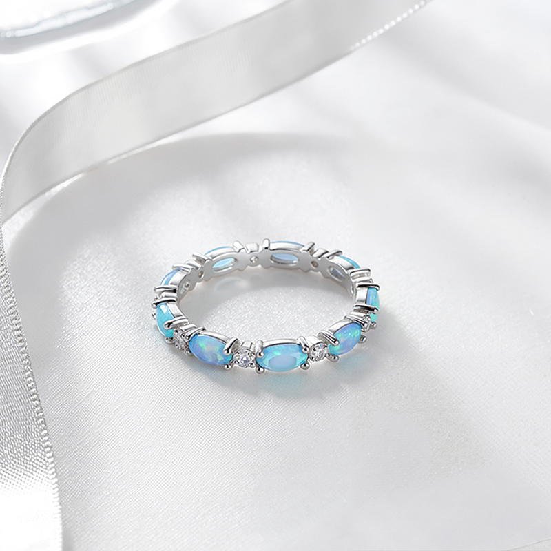 Oval Cut Blue Opal Eternity Band with White Plated Oval Cut Blue Opal Eternity Band with White Plated