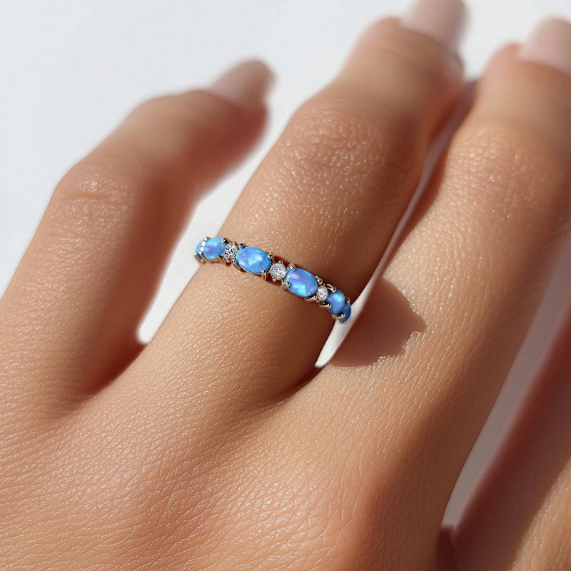Oval Cut Blue Opal Eternity Band with White Plated Oval Cut Blue Opal Eternity Band with White Plated