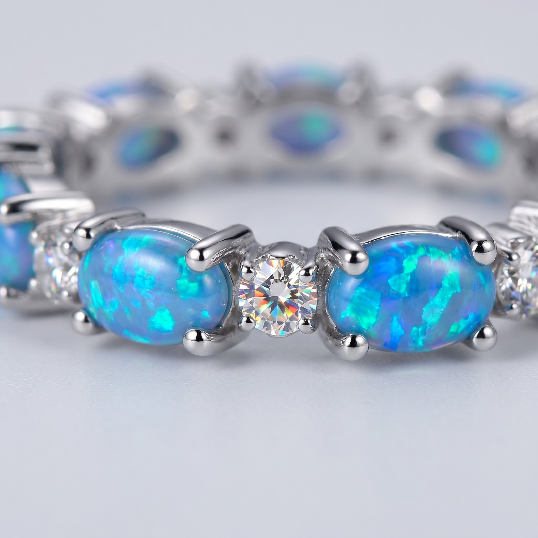 Oval Cut Blue Opal Eternity Band with White Plated
