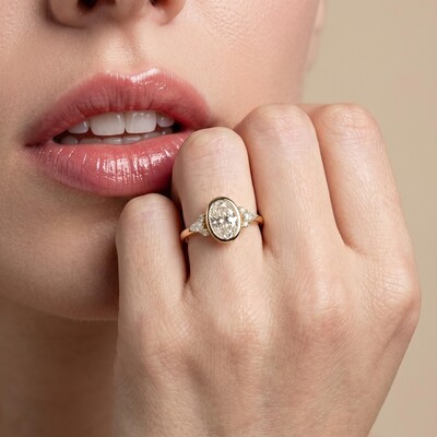 5.4ct. tw. Oval Cut VVS Moissanite Side Stone Engagement Ring