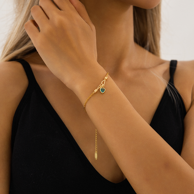 Elegant Gold Chain Bracelet with Heart-Shaped Gemstone Pendant Elegant Gold Chain Bracelet with Heart-Shaped Gemstone Pendant