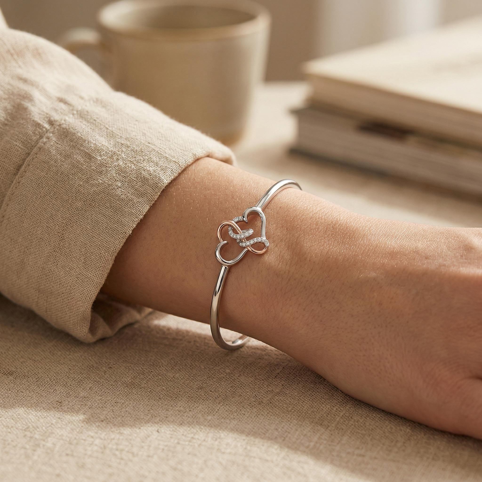 0.5 ct.tw. Two-tone Intertwined Hearts VVS Moissanite S925 Silver Bangle